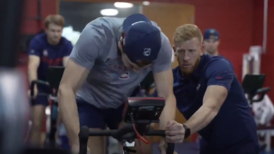 Juraj Slafkovsky riding a stationary bike Monteral testing players